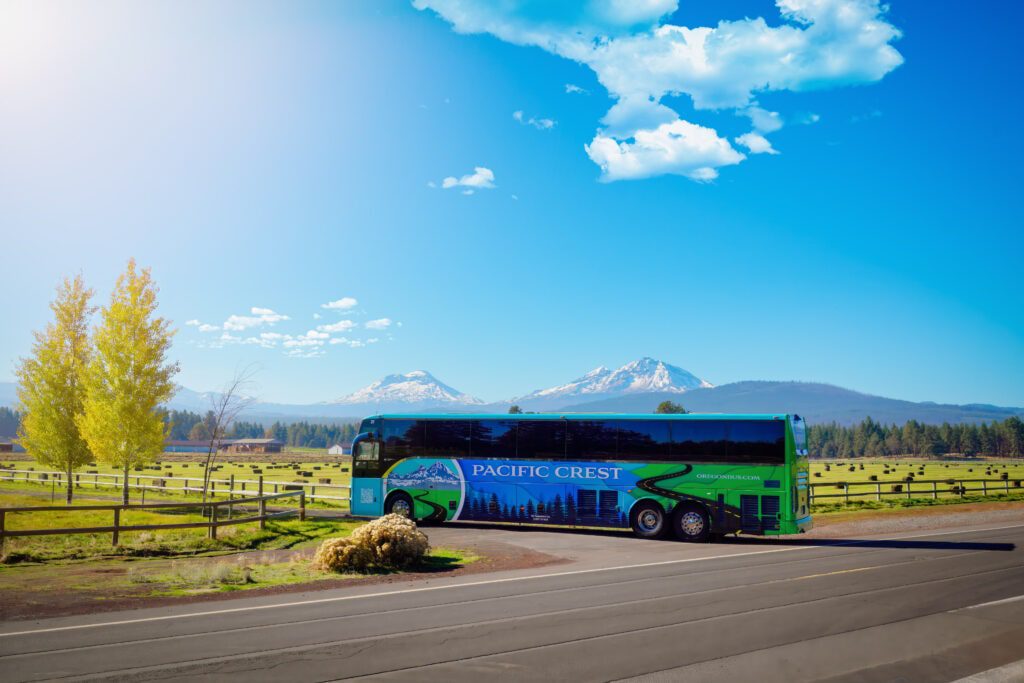 Wide Shot if a PCBL bus driving into a Ranch driveway in Sisters Oregon